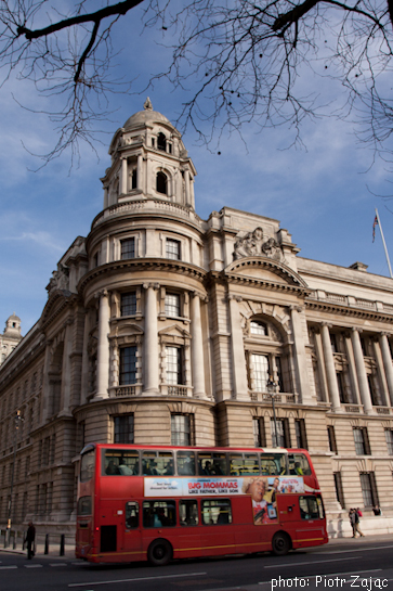 Red double-decker in fron of The Old War Office - Whitehall, London